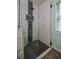 Modern shower with glass enclosure, herringbone tile accent, and sleek fixtures for a spa-like experience at 7113 Silver Mine Xing, Austell, GA 30168