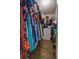 This walk-in closet is well-lit and has a variety of colorful clothing at 7113 Silver Mine Xing, Austell, GA 30168