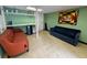 Spacious basement with a seating area and open shelving at 1233 Woodland Ne Ave # 5, Atlanta, GA 30324