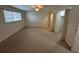 A light-filled bedroom with carpet floors, a ceiling fan, and closet space at 1233 Woodland Ne Ave # 5, Atlanta, GA 30324