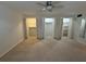 A light-filled bedroom with carpet floors, a ceiling fan, and closet space at 1233 Woodland Ne Ave # 5, Atlanta, GA 30324