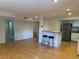 A large living area with an eat-in bar, stainless steel appliances, and laminate flooring at 1233 Woodland Ne Ave # 5, Atlanta, GA 30324