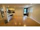A large open space with laminate flooring, access to a back door, and an eat-in kitchen at 1233 Woodland Ne Ave # 5, Atlanta, GA 30324