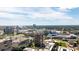Stunning aerial view of a city skyline with stadiums, buildings, and lush greenery under a partly cloudy sky at 285 Centennial Olympic Park Nw Dr # Ph2-7, Atlanta, GA 30313
