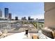 Outdoor balcony featuring comfortable seating with stunning cityscape views at 285 Centennial Olympic Park Nw Dr # Ph2-7, Atlanta, GA 30313