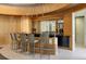 Stylish bar area with modern stools and lighting, perfect for entertaining guests and enjoying drinks at 285 Centennial Olympic Park Nw Dr # Ph2-7, Atlanta, GA 30313