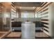 Contemporary bathroom featuring dual sinks, modern fixtures, large mirror, and a glass-enclosed shower at 285 Centennial Olympic Park Nw Dr # Ph2-7, Atlanta, GA 30313