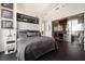 Stylish bedroom with modern finishes, ensuite bathroom, and cityscape view at 285 Centennial Olympic Park Nw Dr # Ph2-7, Atlanta, GA 30313