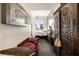 Modern suite with bed, bench, chest, and city views at 285 Centennial Olympic Park Nw Dr # Ph2-7, Atlanta, GA 30313