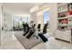 Modern dining room with a glass table, sleek black chairs, and city views at 285 Centennial Olympic Park Nw Dr # Ph2-7, Atlanta, GA 30313