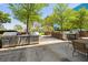 Outdoor grilling area with multiple stainless steel grills, seating, and lush landscaping at 285 Centennial Olympic Park Nw Dr # Ph2-7, Atlanta, GA 30313