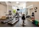 Well-equipped gym featuring treadmills, elliptical machines, stationary bike, and weight balls at 285 Centennial Olympic Park Nw Dr # Ph2-7, Atlanta, GA 30313