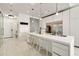 Modern kitchen featuring stainless steel appliances, a large island, and sleek white cabinetry at 285 Centennial Olympic Park Nw Dr # Ph2-7, Atlanta, GA 30313