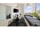 Spacious living room with modern decor, a large sectional, and a view of the city skyline from floor to ceiling windows at 285 Centennial Olympic Park Nw Dr # Ph2-7, Atlanta, GA 30313
