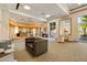 Spacious lounge area with a curved bar, comfortable seating, and access to a patio for relaxation and entertainment at 285 Centennial Olympic Park Nw Dr # Ph2-7, Atlanta, GA 30313