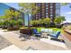 Inviting outdoor lounge with comfortable seating and manicured landscaping at 285 Centennial Olympic Park Nw Dr # Ph2-7, Atlanta, GA 30313
