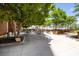 Outdoor patio featuring dining tables, lush trees, and landscaping at 285 Centennial Olympic Park Nw Dr # Ph2-7, Atlanta, GA 30313