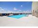 Inviting rooftop pool with comfortable lounge seating surrounded by flower planters and city views at 285 Centennial Olympic Park Nw Dr # Ph2-7, Atlanta, GA 30313