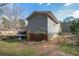 Exterior side yard view with a deck, and a fenced area, perfect for outdoor enjoyment and activities at 315 Charlotte Blvd, Stockbridge, GA 30281