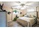 Charming bedroom featuring stylish wood floors, a ceiling fan, and lots of natural light, creating a cozy and inviting space at 315 Charlotte Blvd, Stockbridge, GA 30281