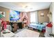 Cozy bedroom with charming decor, comfortable furniture, and a bright window at 315 Charlotte Blvd, Stockbridge, GA 30281