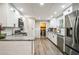 Well-lit kitchen with white cabinets, updated appliances, and granite countertops at 315 Charlotte Blvd, Stockbridge, GA 30281