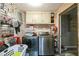 Functional laundry room with washer, dryer, and storage shelves at 315 Charlotte Blvd, Stockbridge, GA 30281