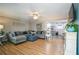 Inviting living room with hardwood floors, plush seating, and seamless flow to kitchen at 315 Charlotte Blvd, Stockbridge, GA 30281