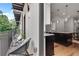 Cozy balcony with outdoor seating, overlooking the kitchen area inside at 574 Boulevard Ne Pl # 4, Atlanta, GA 30308