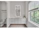 Stylish bathroom with sleek vanity, illuminated mirror and fixtures, and natural lighting at 574 Boulevard Ne Pl # 4, Atlanta, GA 30308