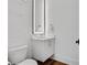Modern powder room with vanity, marble wall and wood flooring at 574 Boulevard Ne Pl # 4, Atlanta, GA 30308