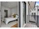 Bright bedroom with white brick accent wall and private balcony at 574 Boulevard Ne Pl # 4, Atlanta, GA 30308