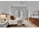 Bright bedroom featuring modern decor, hardwood floors, and access to an outdoor balcony at 574 Boulevard Ne Pl # 4, Atlanta, GA 30308