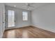 Bright bedroom with hardwood floors, ceiling fan, and direct access to an outdoor terrace at 574 Boulevard Ne Pl # 4, Atlanta, GA 30308