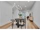 Open-concept dining area with hardwood floors, stylish rug, and modern chandelier at 574 Boulevard Ne Pl # 4, Atlanta, GA 30308