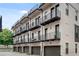 Luxury townhome with private balconies, garages, and brick facade at 574 Boulevard Ne Pl # 4, Atlanta, GA 30308