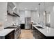 Bright kitchen with stainless steel appliances, large island, and white and dark cabinetry at 574 Boulevard Ne Pl # 4, Atlanta, GA 30308