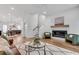 Comfortable living room with fireplace and open to the dining room and kitchen at 574 Boulevard Ne Pl # 4, Atlanta, GA 30308