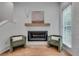 Cozy living room with modern fireplace and comfortable green armchairs at 574 Boulevard Ne Pl # 4, Atlanta, GA 30308