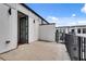Private terrace with metal railing, concrete flooring, and views of neighboring rooftops at 574 Boulevard Ne Pl # 4, Atlanta, GA 30308