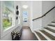 Bright entryway with hardwood floors, stairs, and ample natural light, offering a glimpse of the home's interior at 116 Birch Tree Way, Cumming, GA 30040