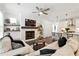 Comfortable living room with a fireplace, hardwood floors, and an open layout connected to the kitchen, ideal for relaxation at 116 Birch Tree Way, Cumming, GA 30040