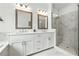 Main bathroom featuring double vanity and glass enclosed shower with marble surround at 116 Birch Tree Way, Cumming, GA 30040