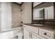 Beautiful bathroom showcasing a bathtub, vanity with dark countertop, and sleek fixtures at 1435 Druid Manor, Atlanta, GA 30329