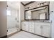 Beautiful bathroom featuring a glass shower enclosure, double sink vanity, and modern fixtures at 1435 Druid Manor, Atlanta, GA 30329