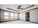 Spacious bedroom boasts natural light from large windows, neutral carpet, and elegant trim at 1435 Druid Manor, Atlanta, GA 30329