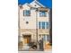 Charming multi-story townhouse with stone accents, gated entrance, and classic architectural details at 1435 Druid Manor, Atlanta, GA 30329