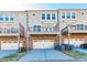 Townhome exterior features attached garages and private decks for outdoor living at 1435 Druid Manor, Atlanta, GA 30329