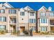 Elegant townhome with brick and stone accents, complemented by a well-maintained front yard at 1435 Druid Manor, Atlanta, GA 30329
