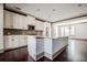 Bright kitchen featuring white cabinets, stainless steel appliances, and a large central island at 1435 Druid Manor, Atlanta, GA 30329